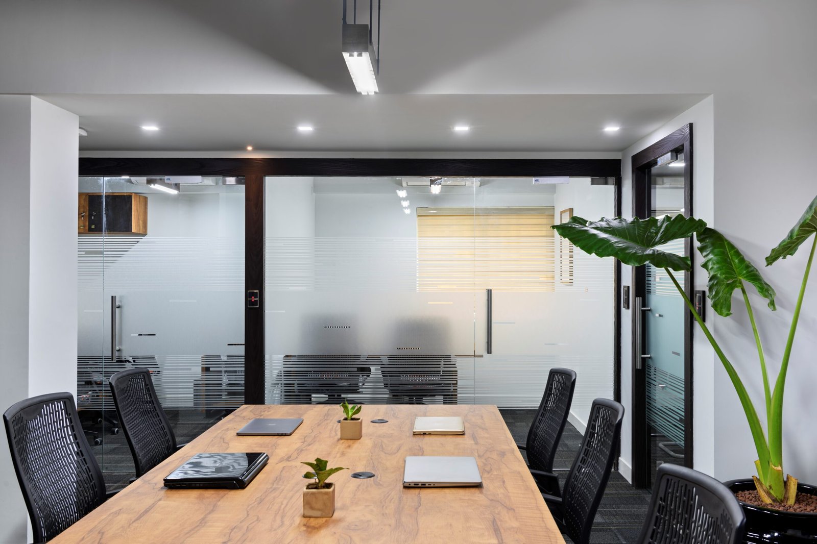 A dynamic view of a collaborative dedicated desk in the best coworking space in Thrissur, emphasizing the modern amenities and community-driven design.